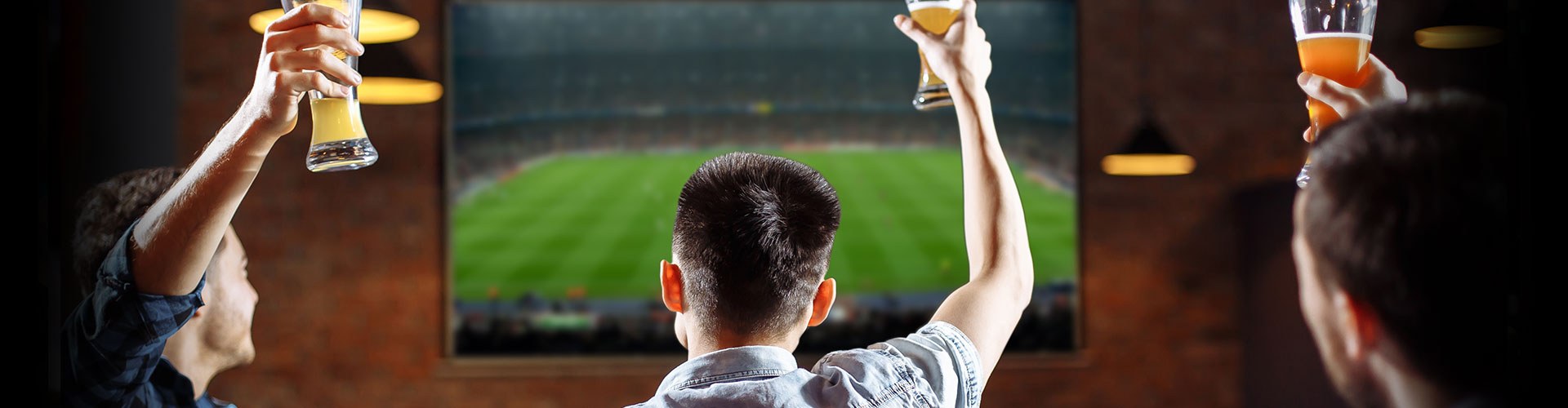 people having a beer watching a game