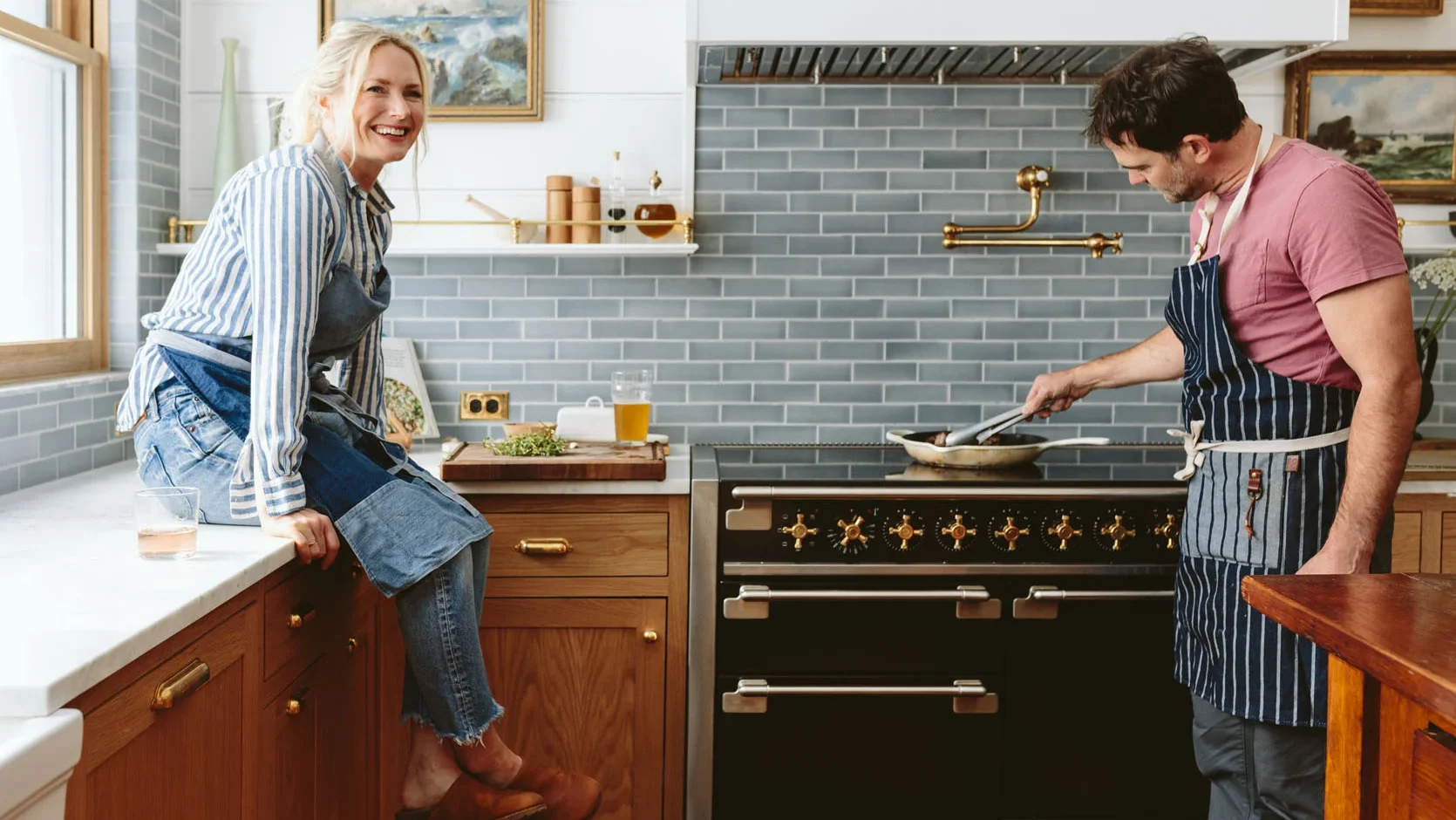 A couple in the living room cooking using their induction range