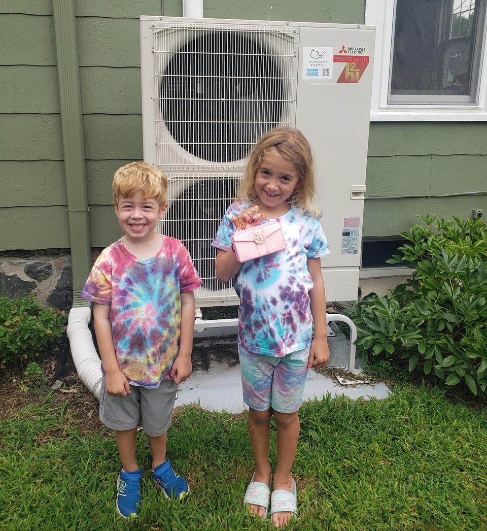 Kids from Boston enjoying their newly-installed Mitsubishi cold climate heat pump