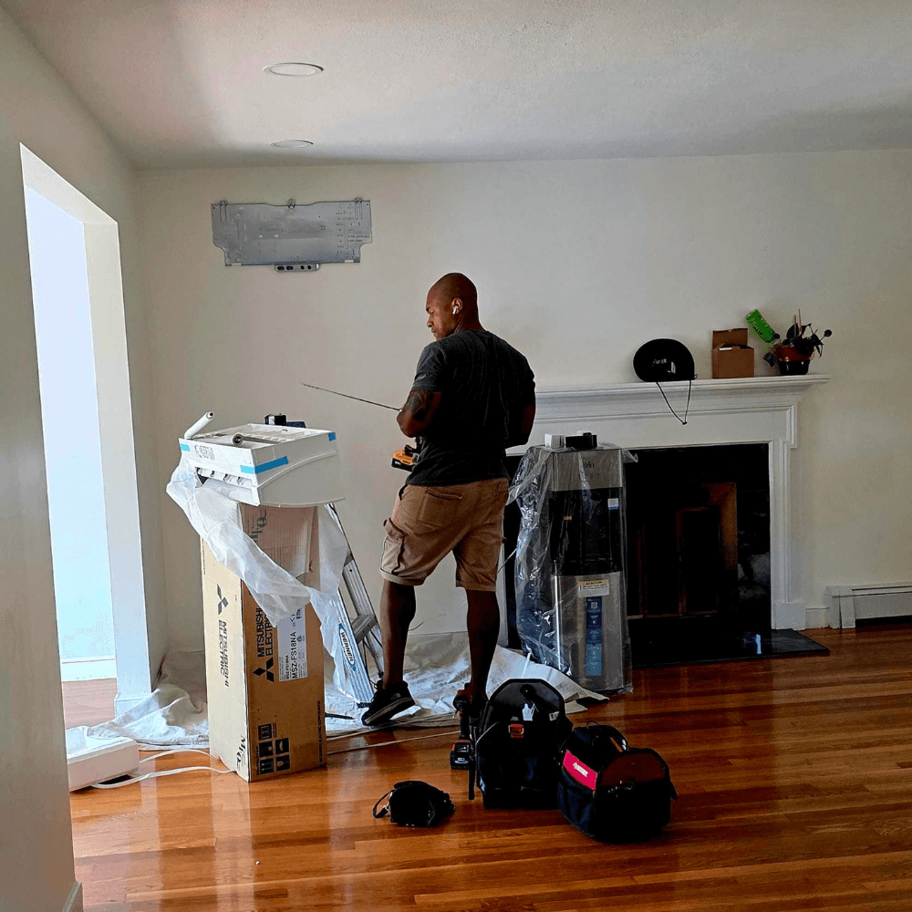 Elephant energy team installing mini split inside