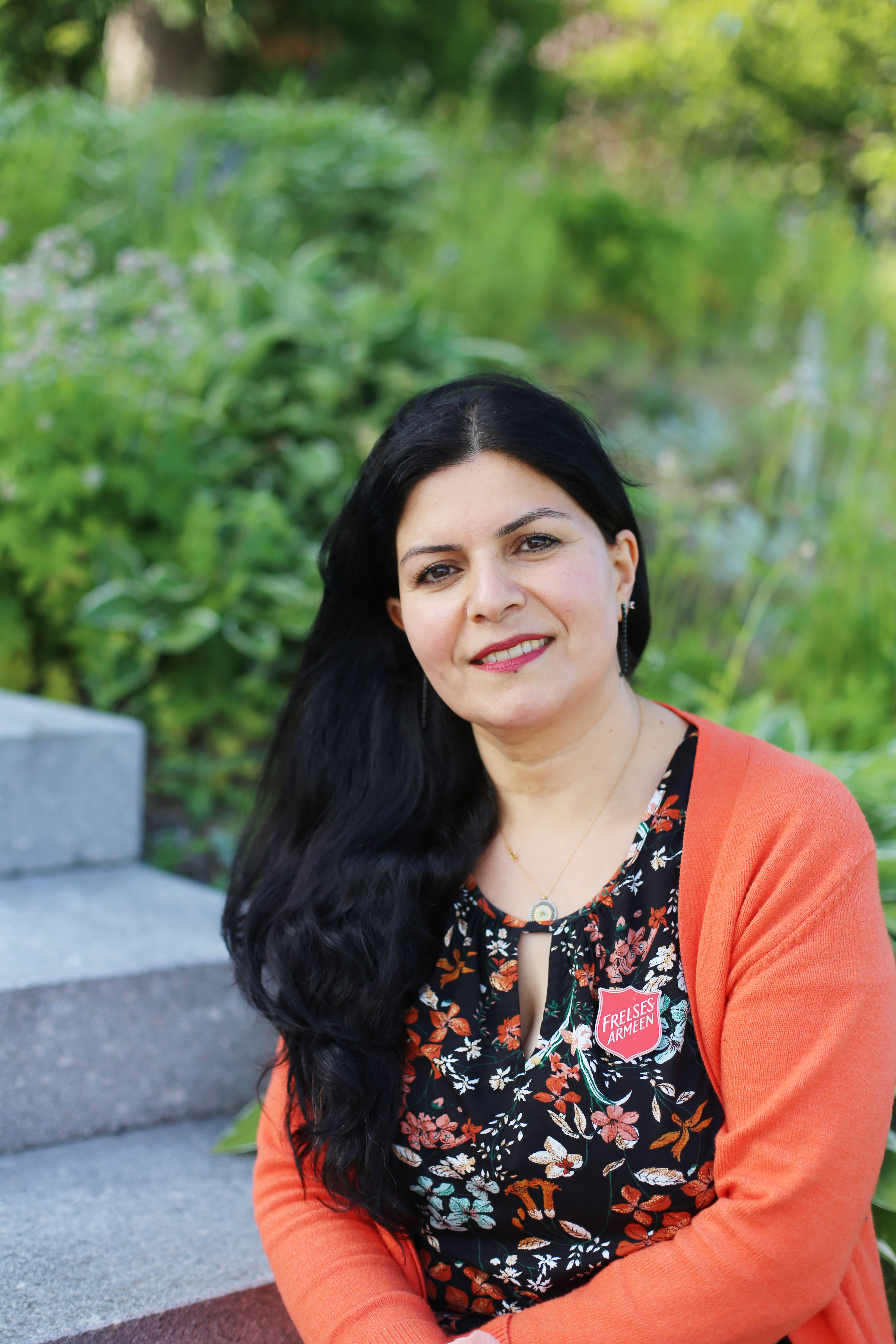 Azam, mamma og hjelpeleder på leieren