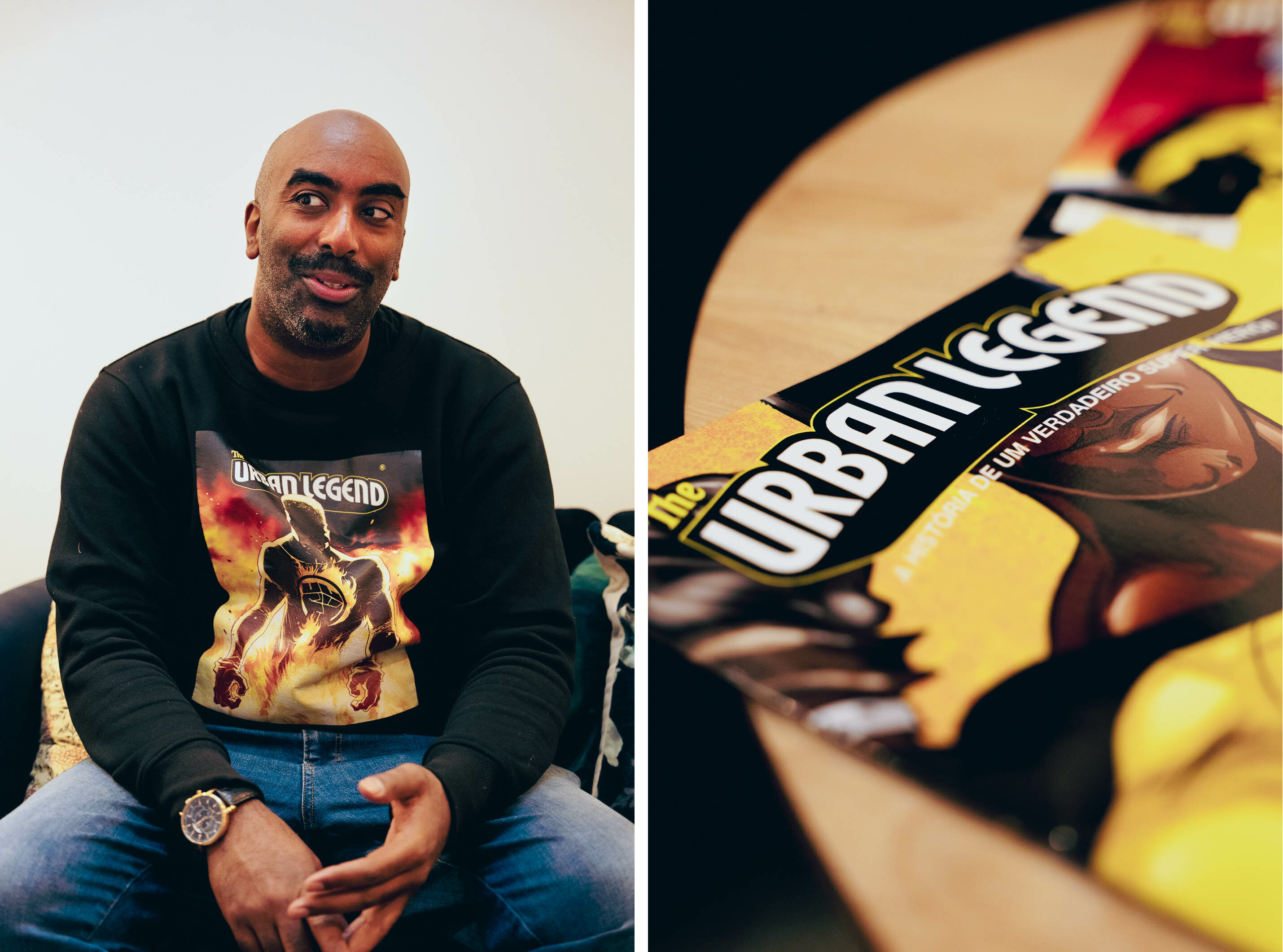 Mørhudet og skallet mann med sort collegegenser som det er en superhelttegning i gult og rødt på. Øverst på genseren og på bladet som er ved siden av, står det Urban Legend.