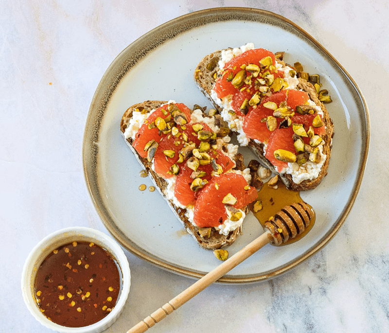 Sunkist® Grapefruit & Cottage Cheese Toasts with Pistachios & Hot Honey