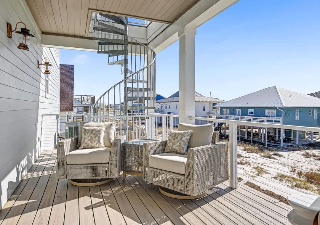 First floor deck with a spiral staircase to the rooftop