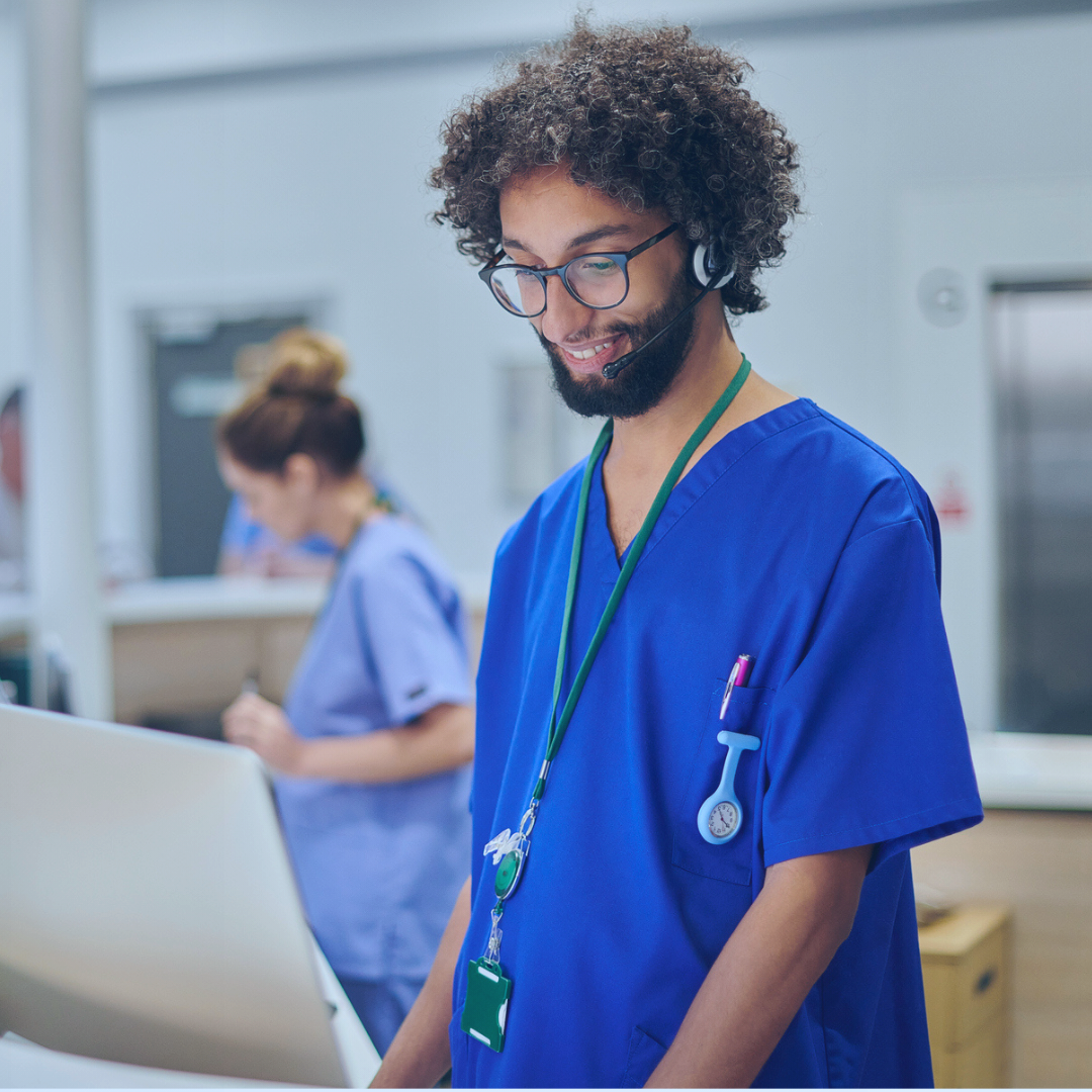 Doctor reviewing data on a computer enabled by process transformation following the implementation of a ServiceNow solution.