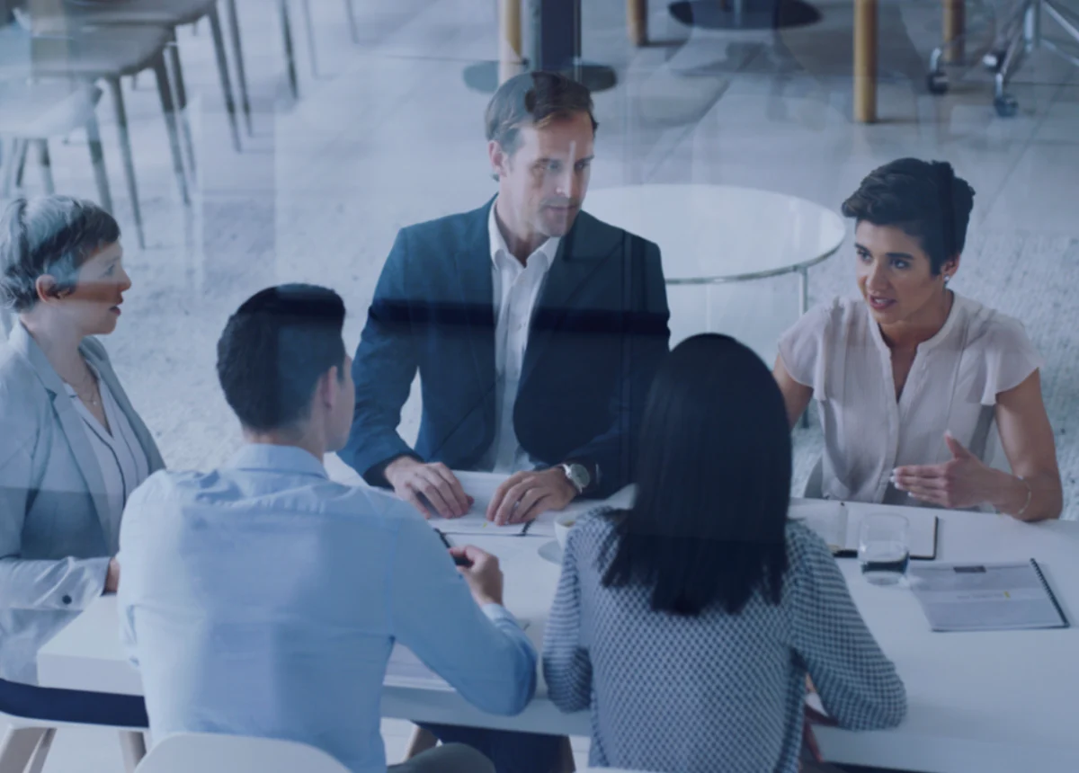 Digital transformation – Group of people discussing around a table.