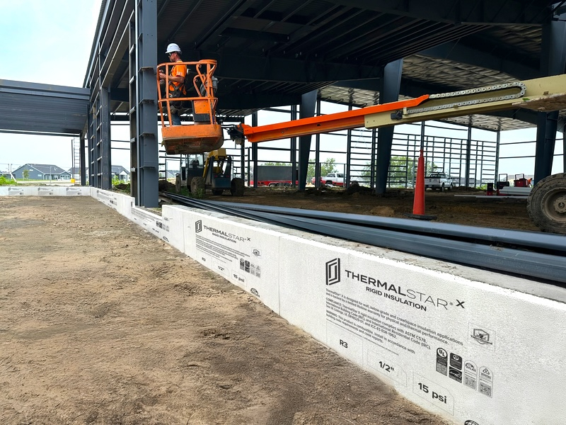 Atlas ThermalStar expanded polystyrene insulation installed below grade on a commercial building.