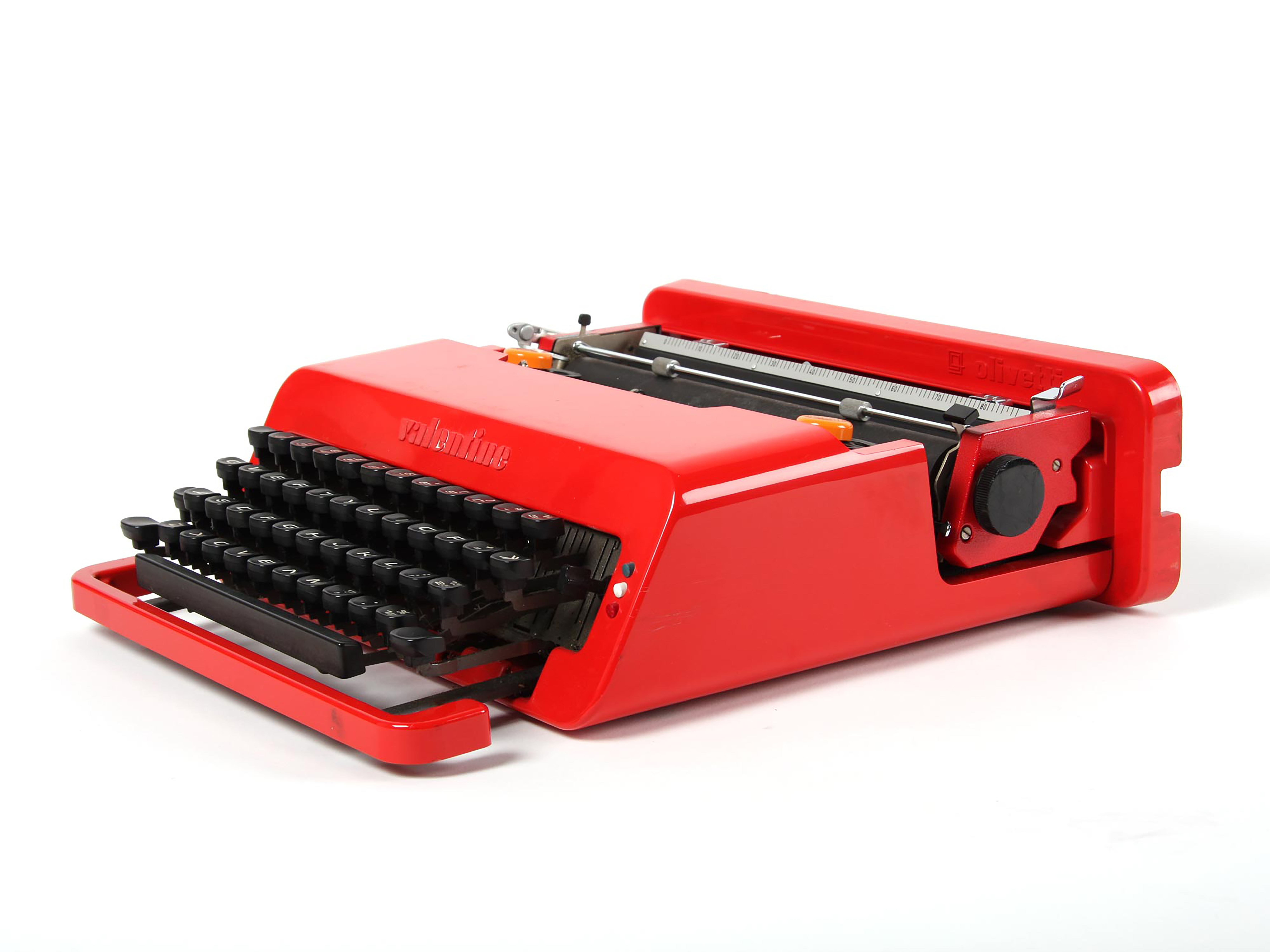 A red typewriter with black keys.