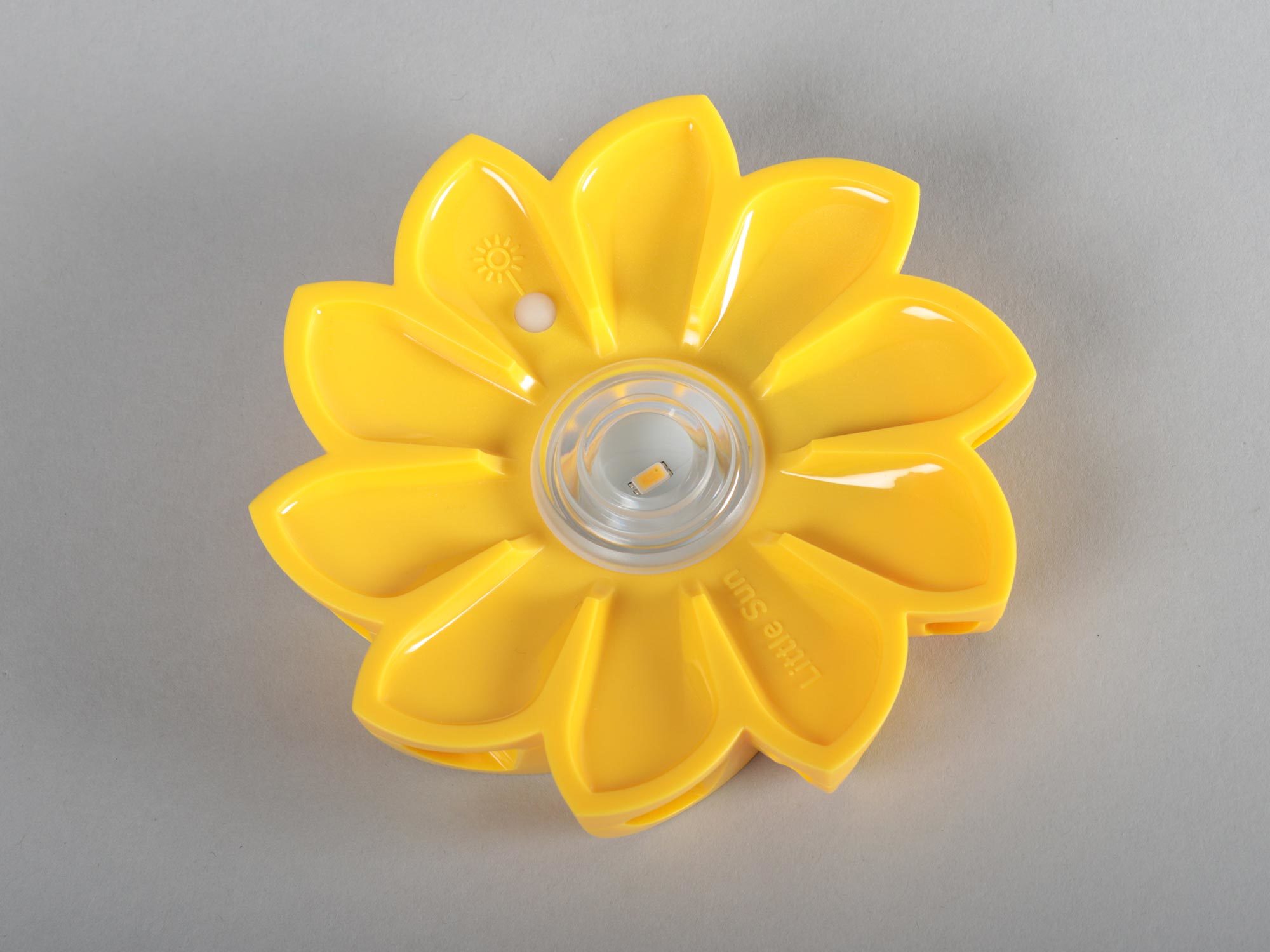 A yellow portable solar lamp shaped like a flower