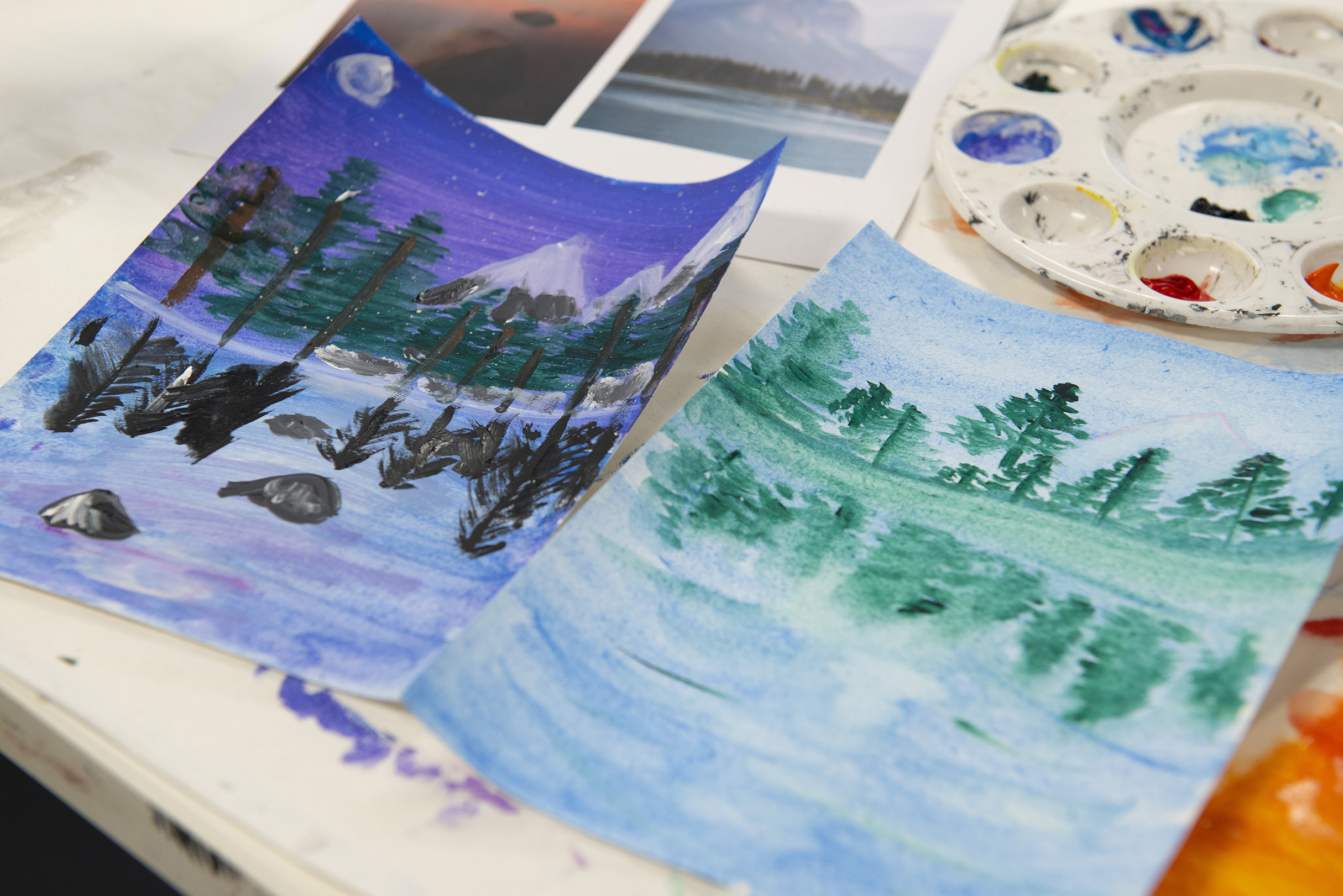 Watercolour image of boats on a lake