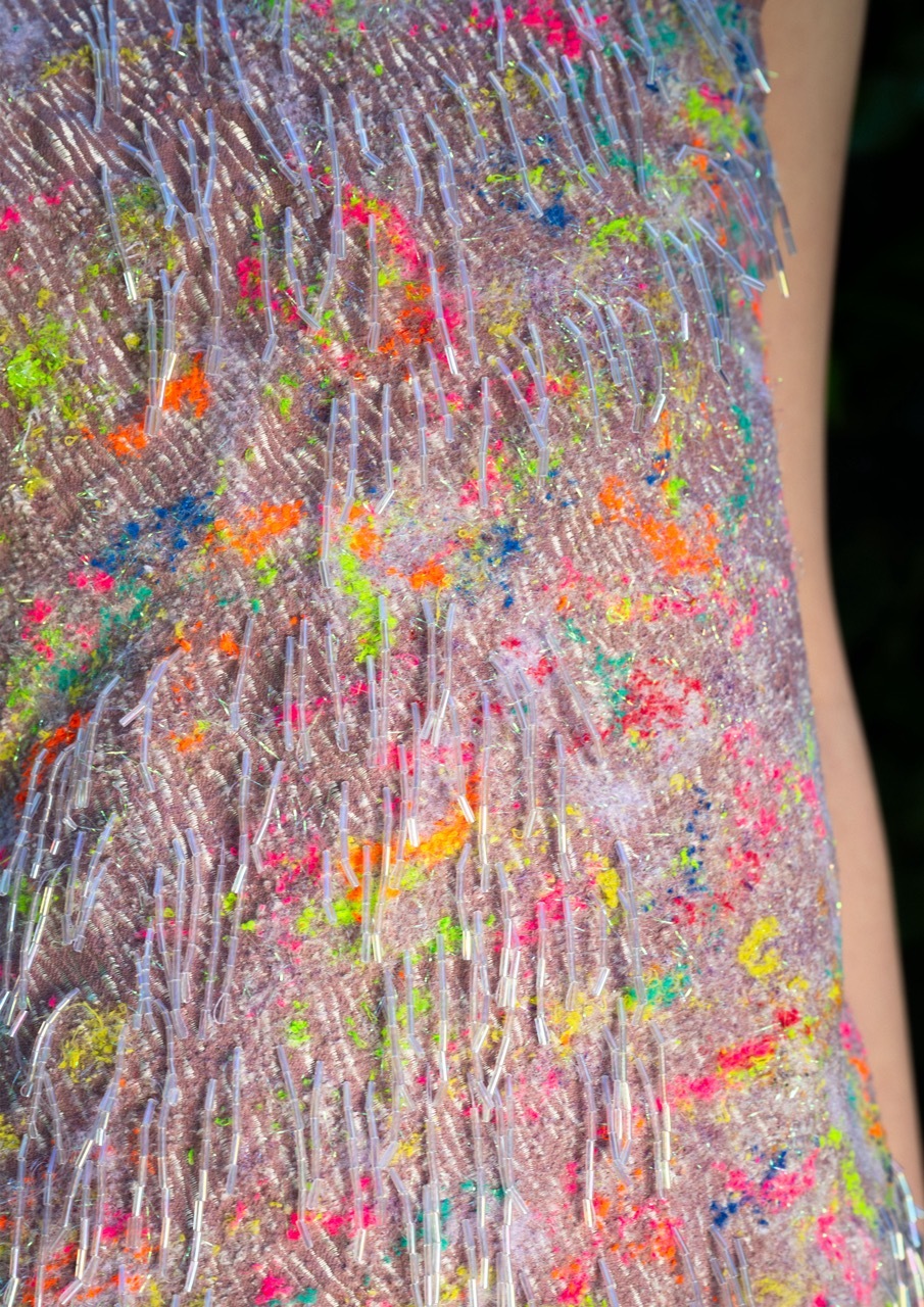 Pastel/rainbow style textile garment, close-up.