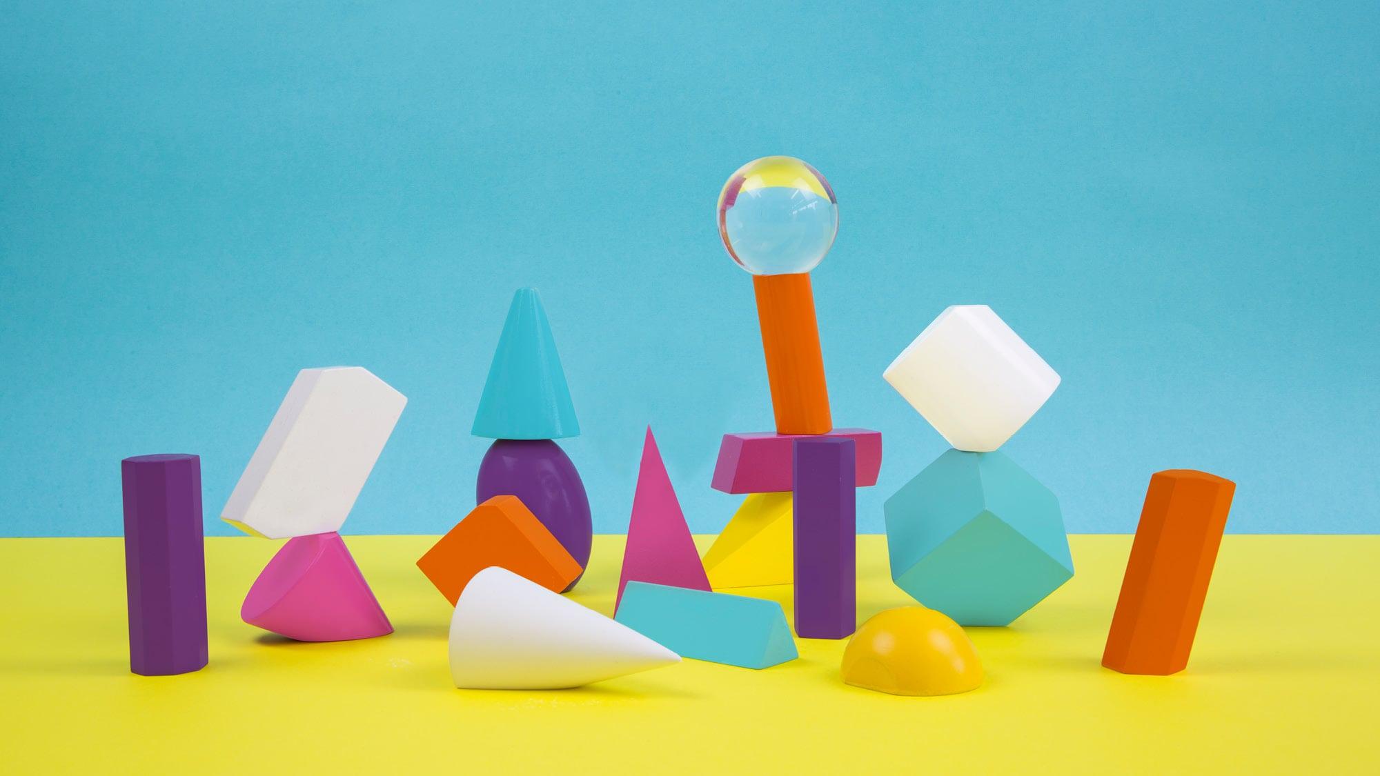 Colourful blocks of different shapes arranged to resemble people.