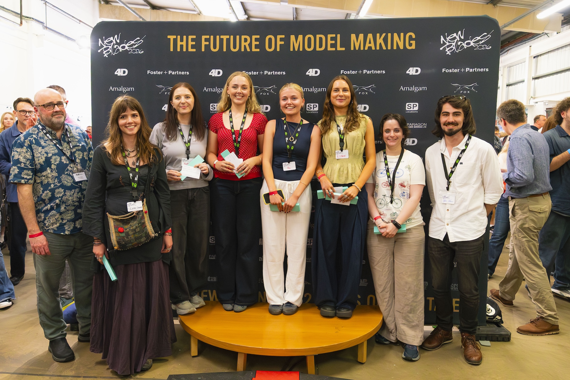 A group of BA (Hons) Modelmaking students stand and pose for a photo with P Johnson at New Blades 2026.