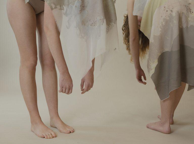 people hanging there hands to the floor