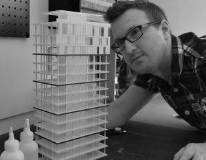 student looking at a model