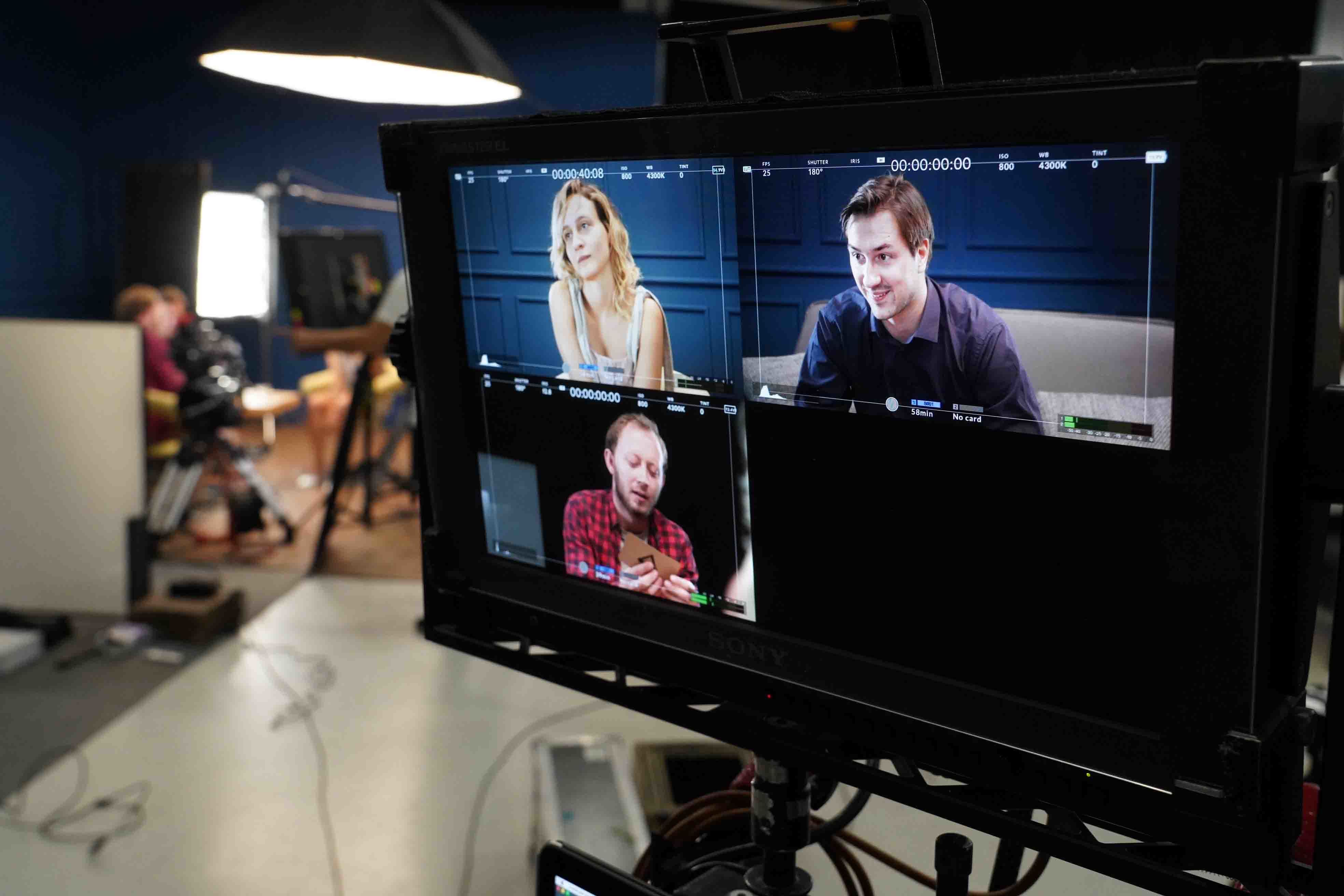 A large monitor showing live footage