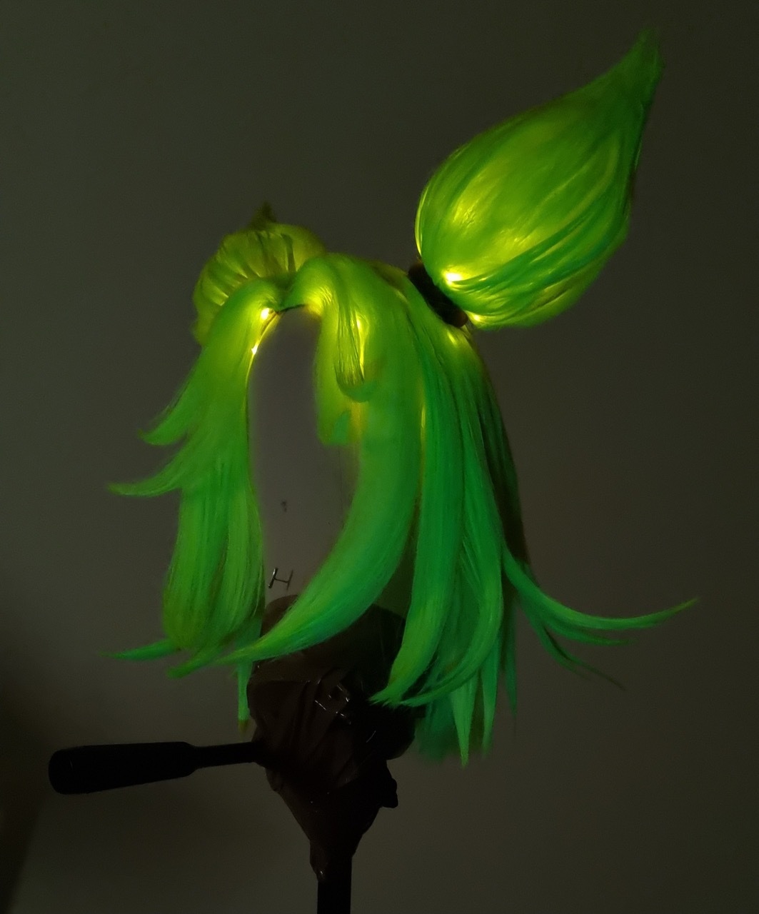 A green anime-style wig with lights by Dora Voros.