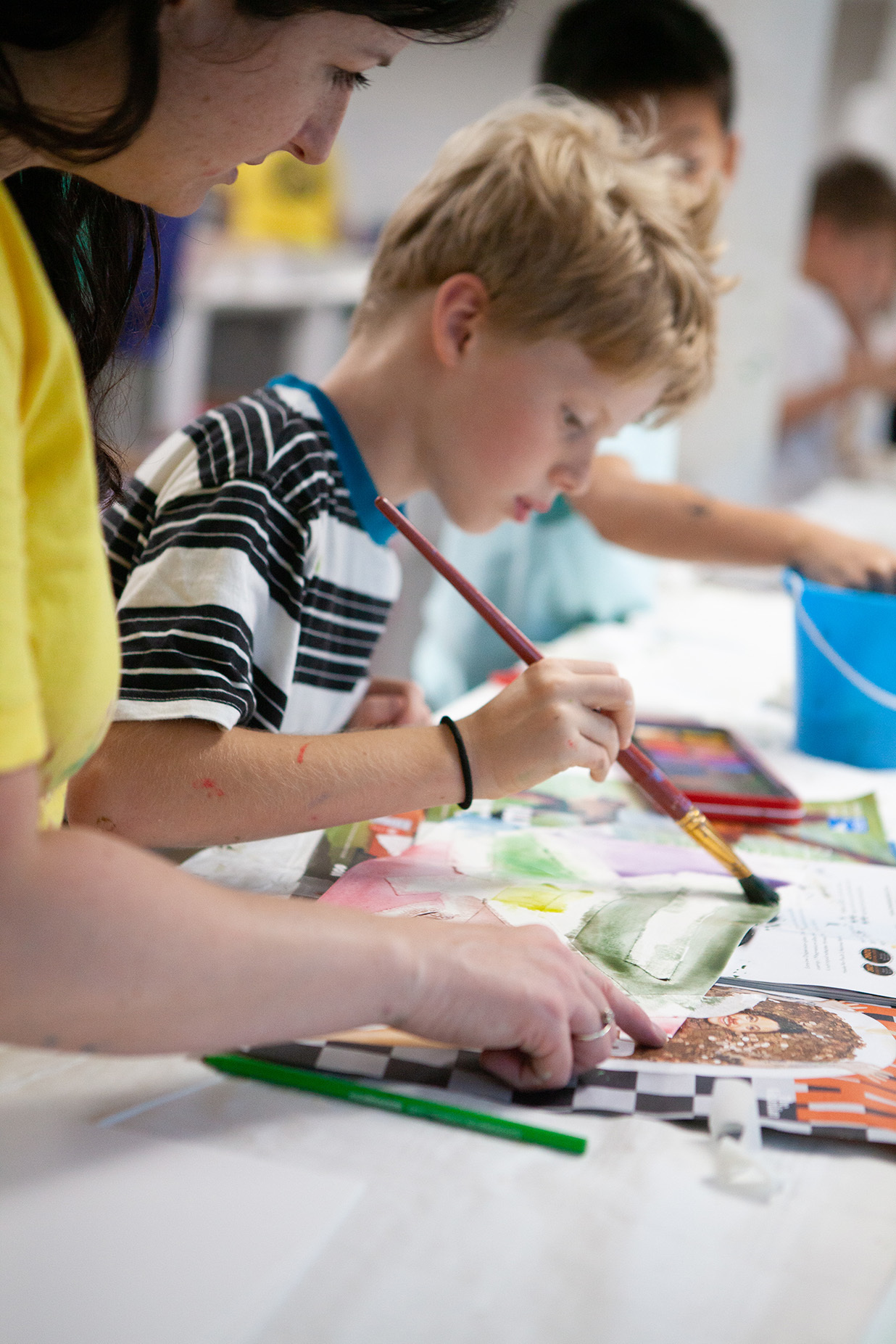 A young student is painting