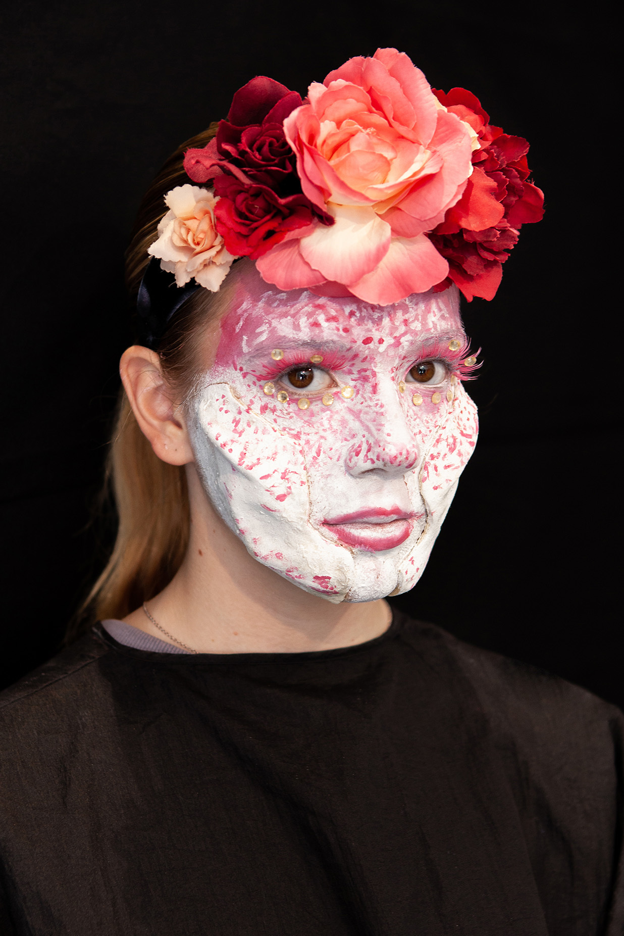 An example of character makeup: a student has flowers sprouting out of their forehead