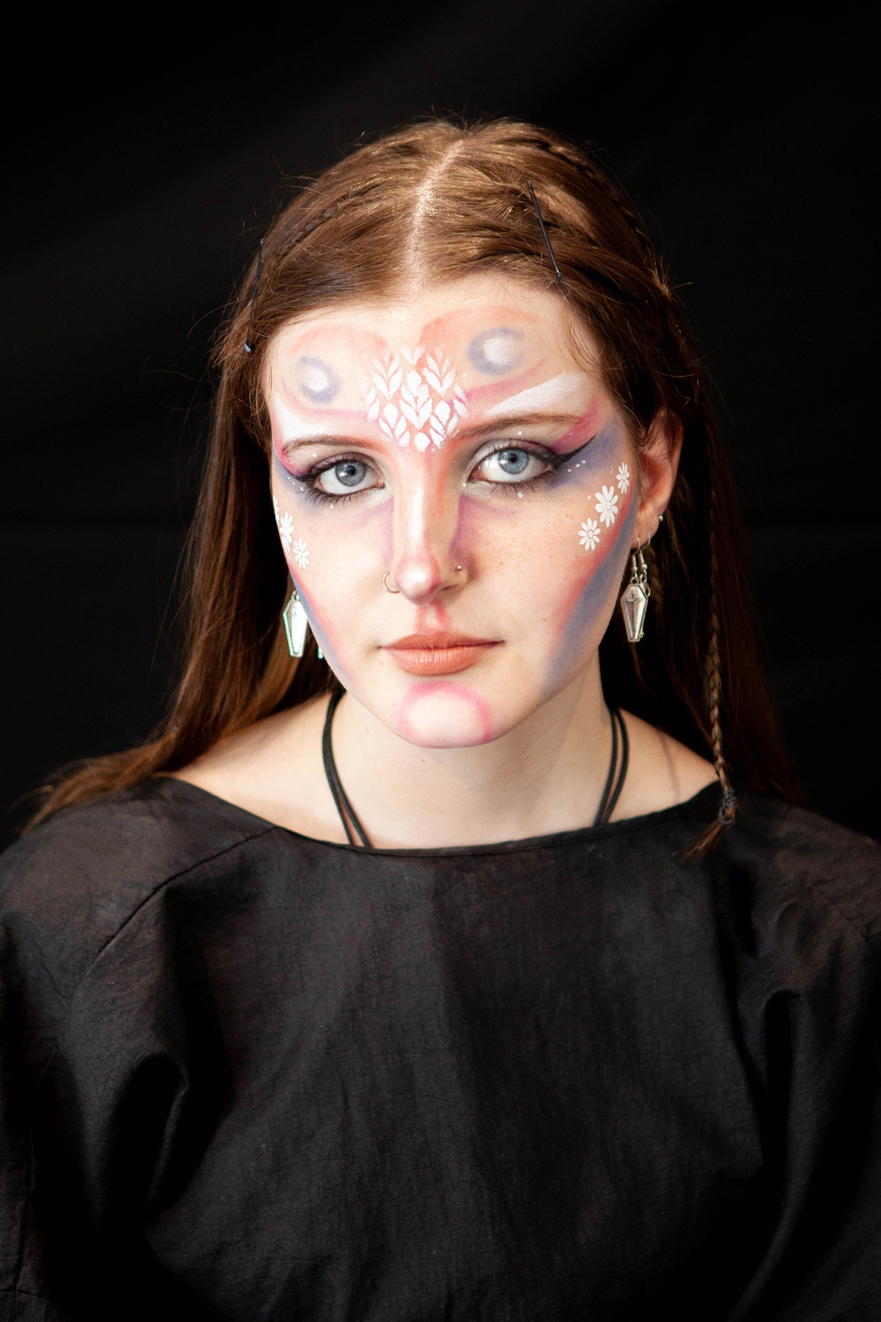 An example of character makeup: a student has prosthetic lumps on their face