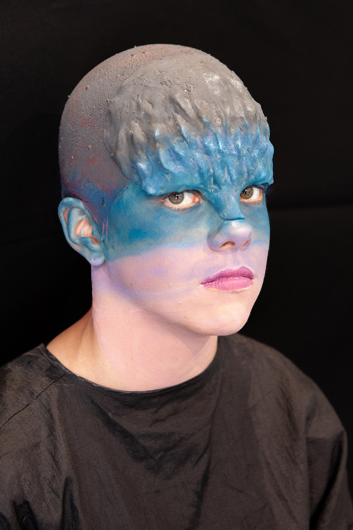An example of character makeup: student has an ombre face blending from grey into blue