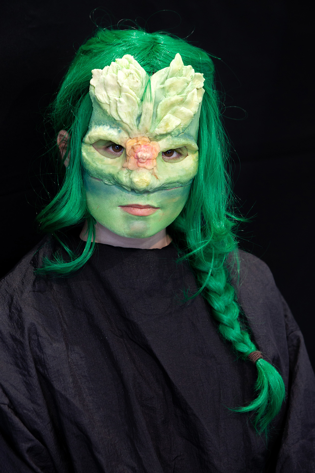 An example of character makeup: a student has their hair in a braid and has prothetic leaves protruding from their forehead