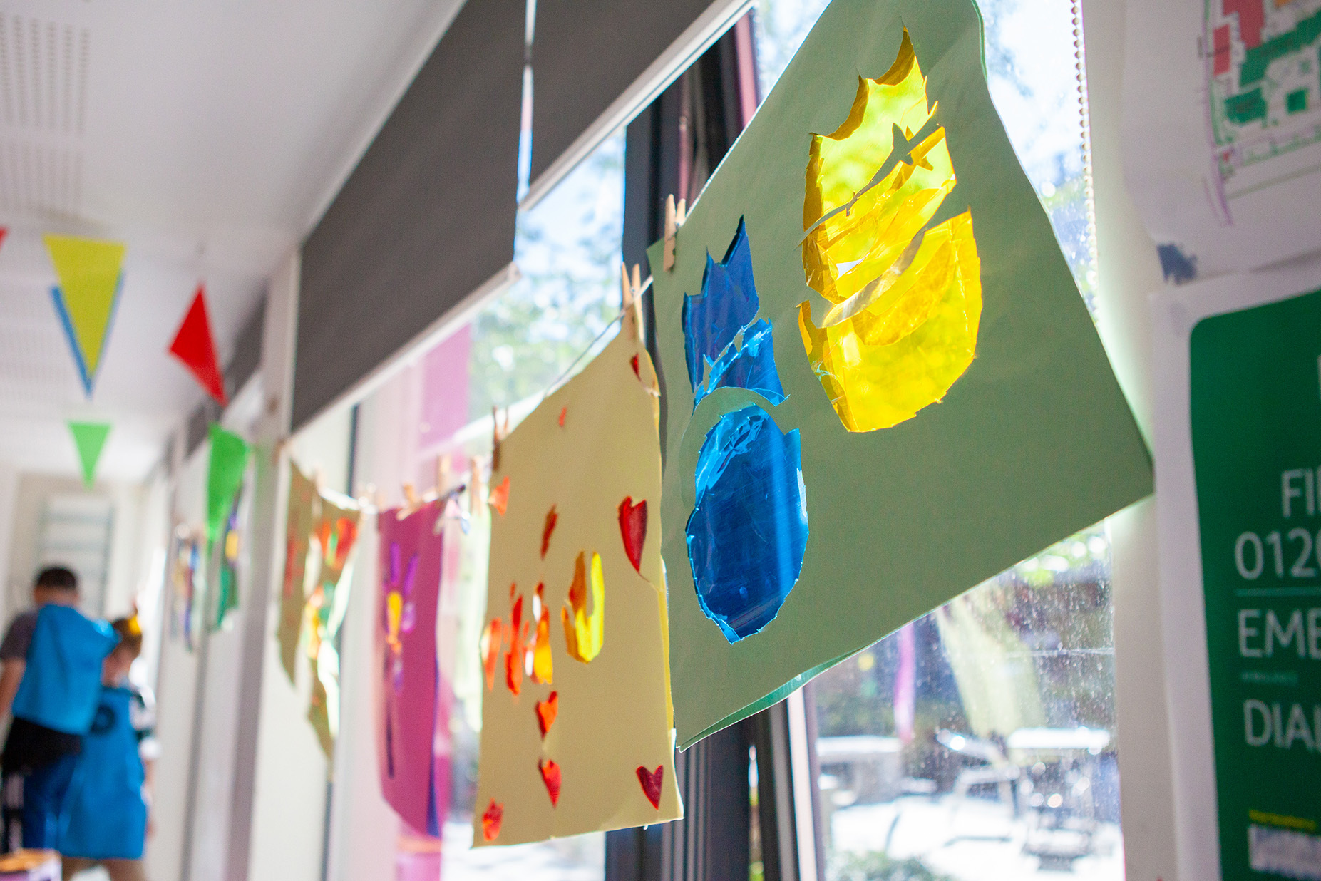Stain-glass window effect work is hanging in a window