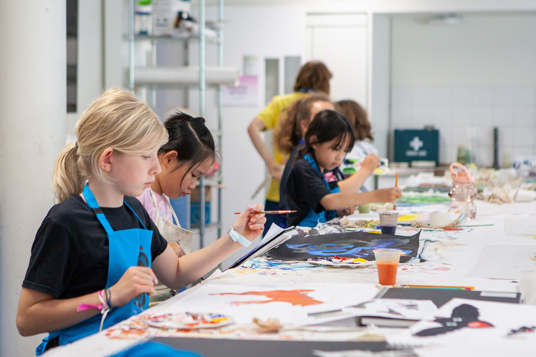 A group of students are painting