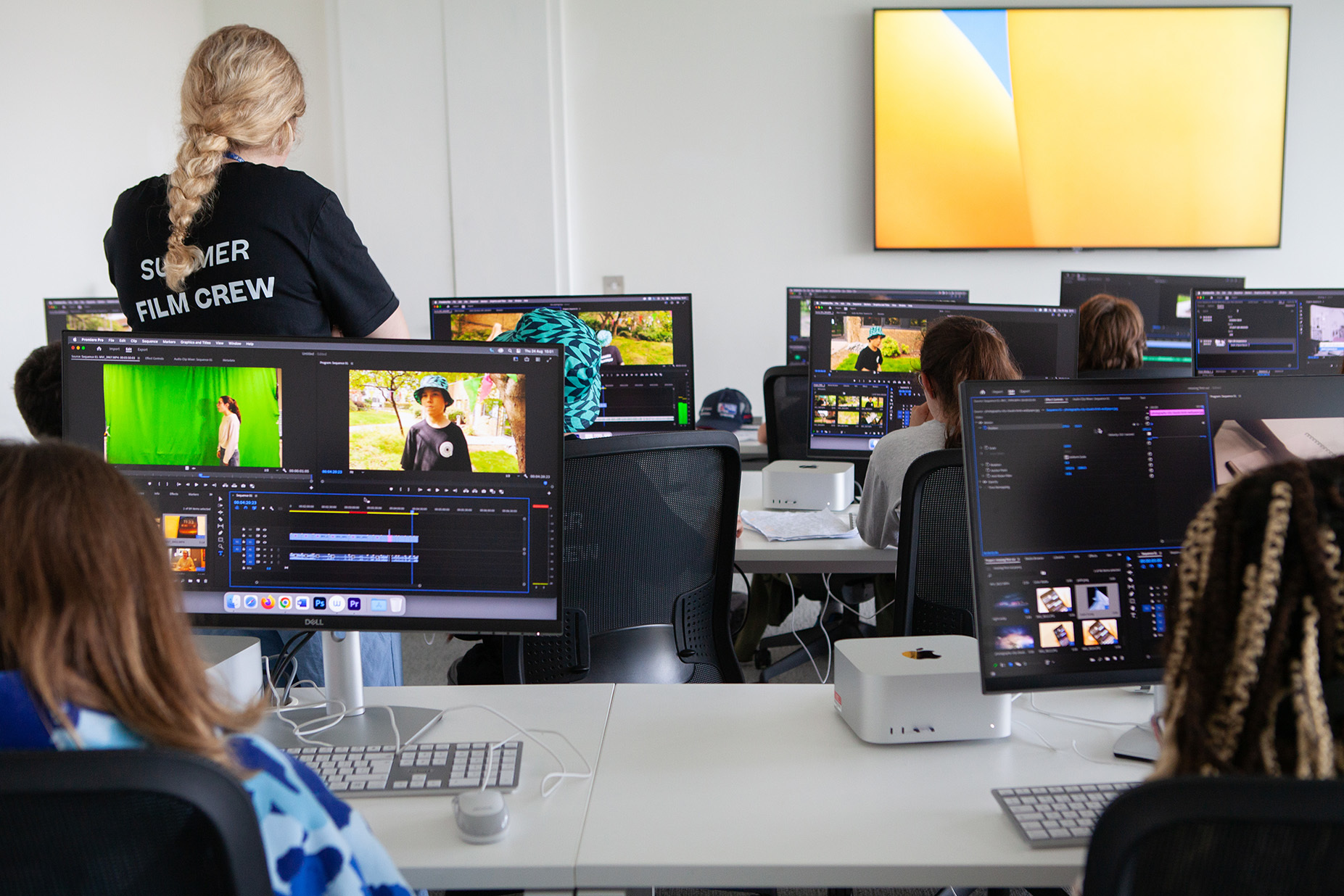 Students are editing their films using pc software
