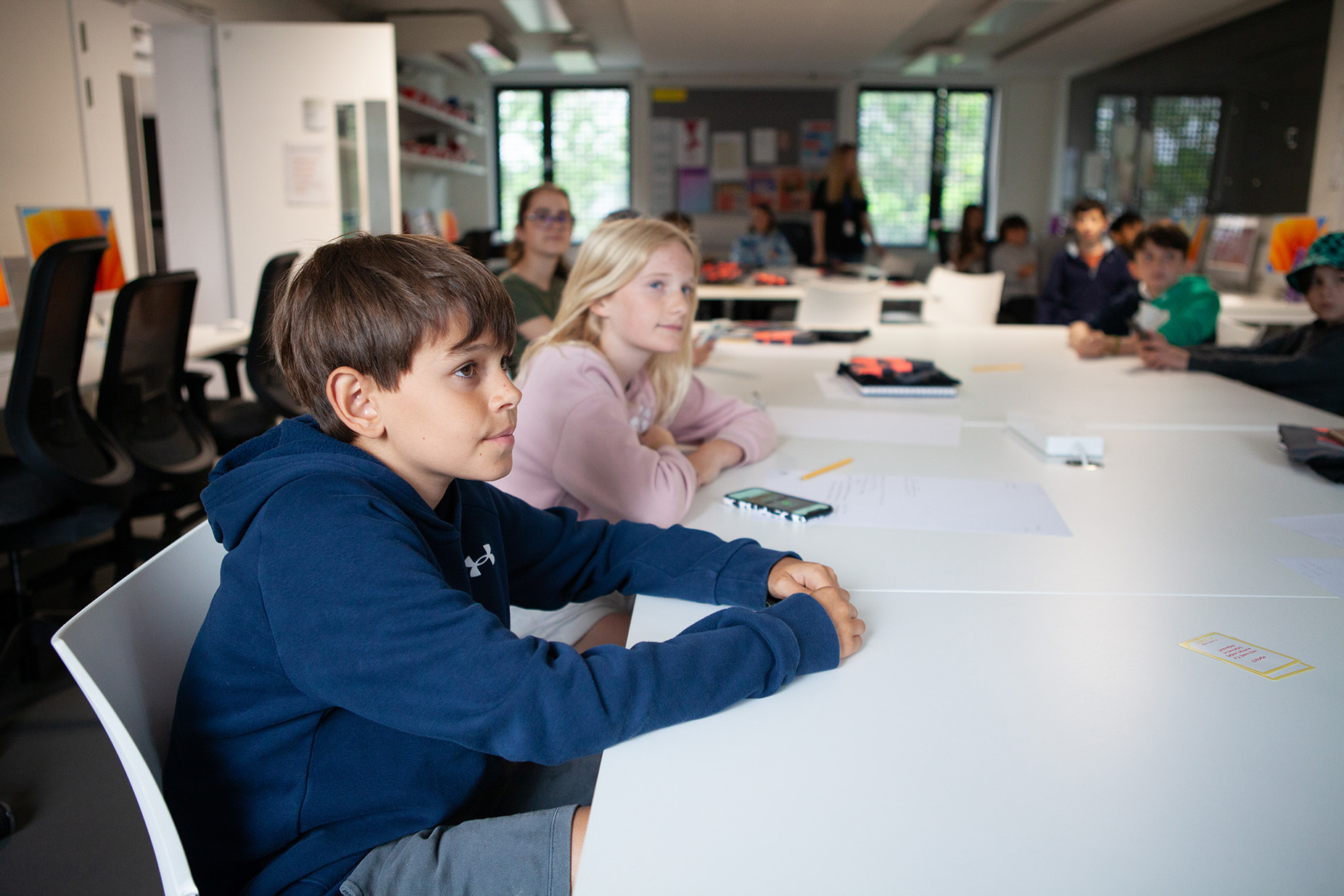 A group of students sitting around a table