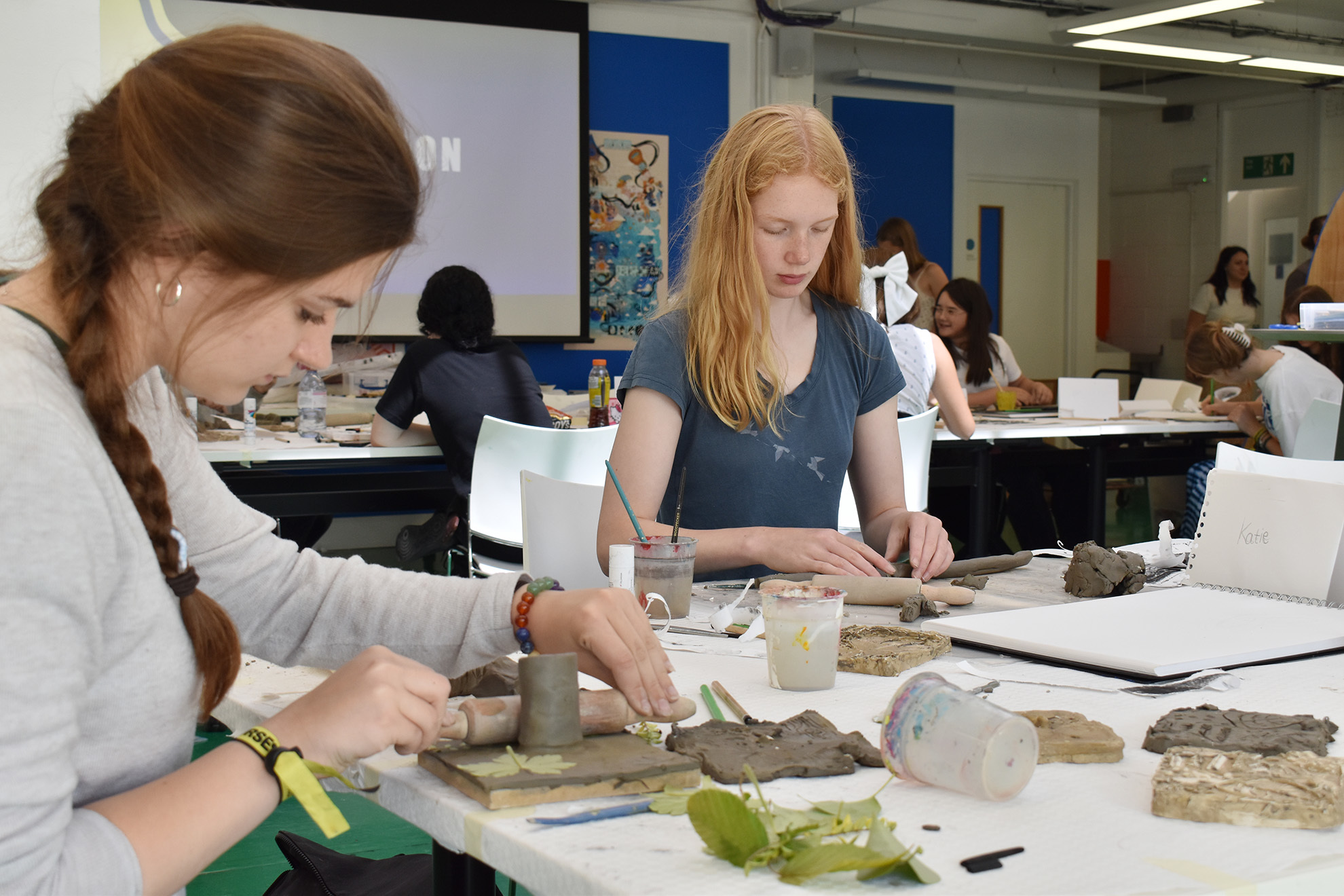 Students working with clay