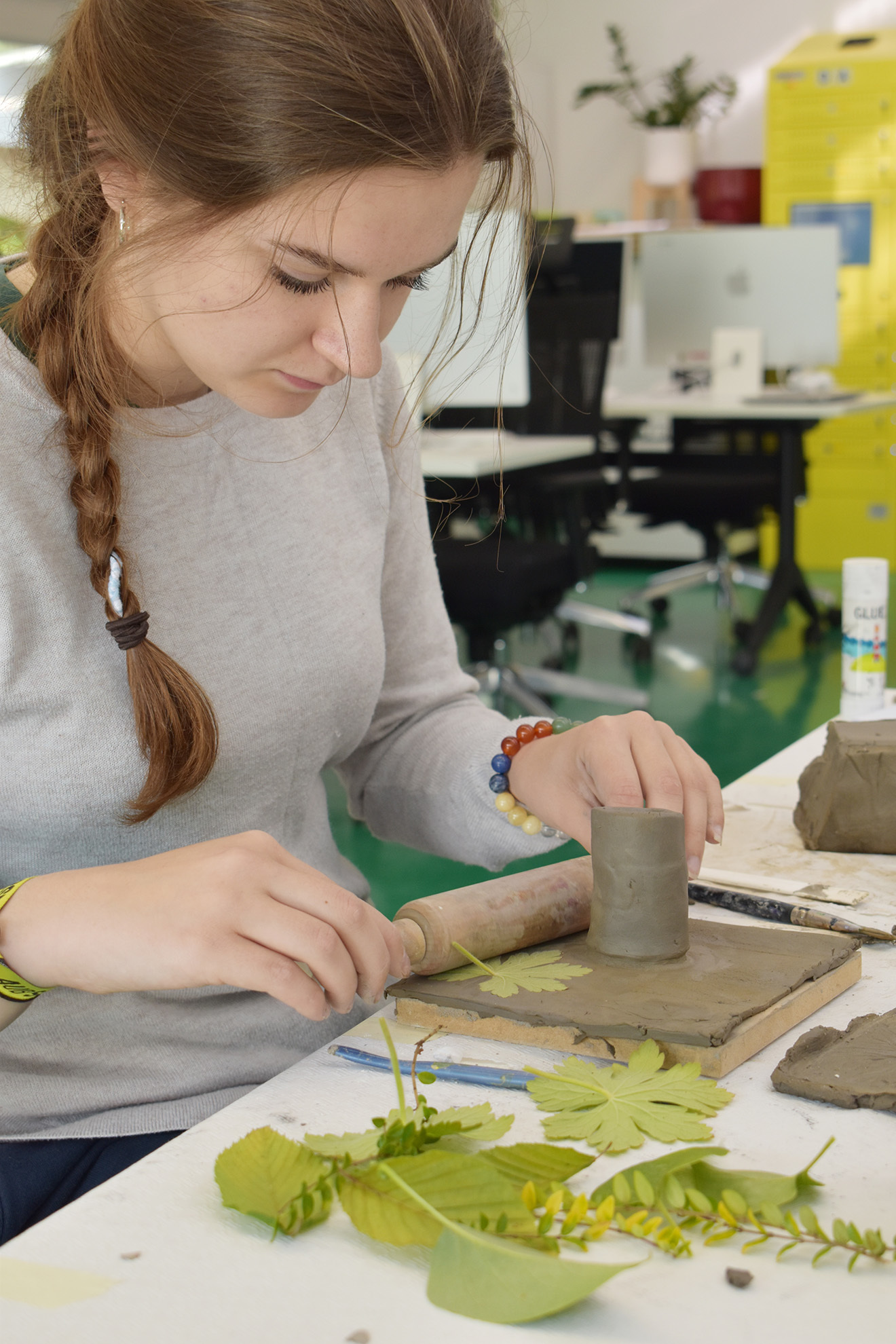 Students working with clay
