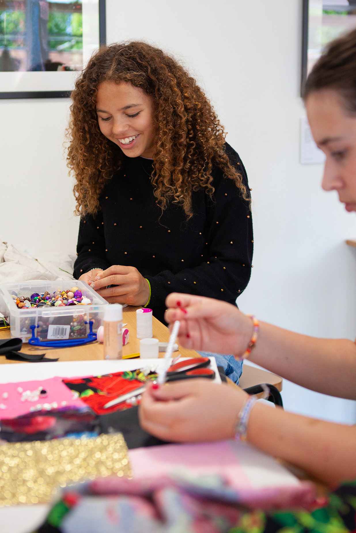 Students are hand stitching