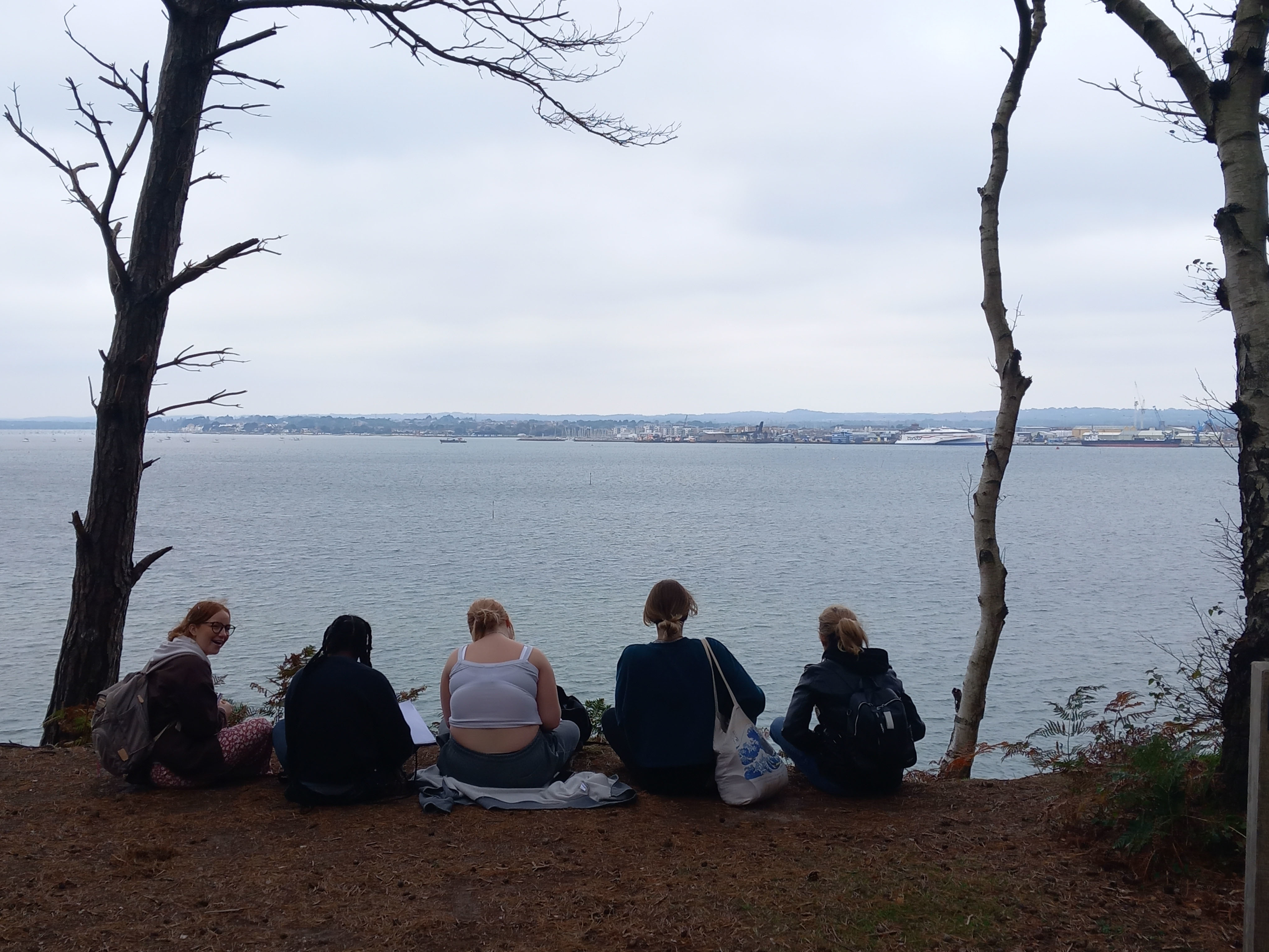 Creative Writing students looking out to the sea on Brownsea Island.
