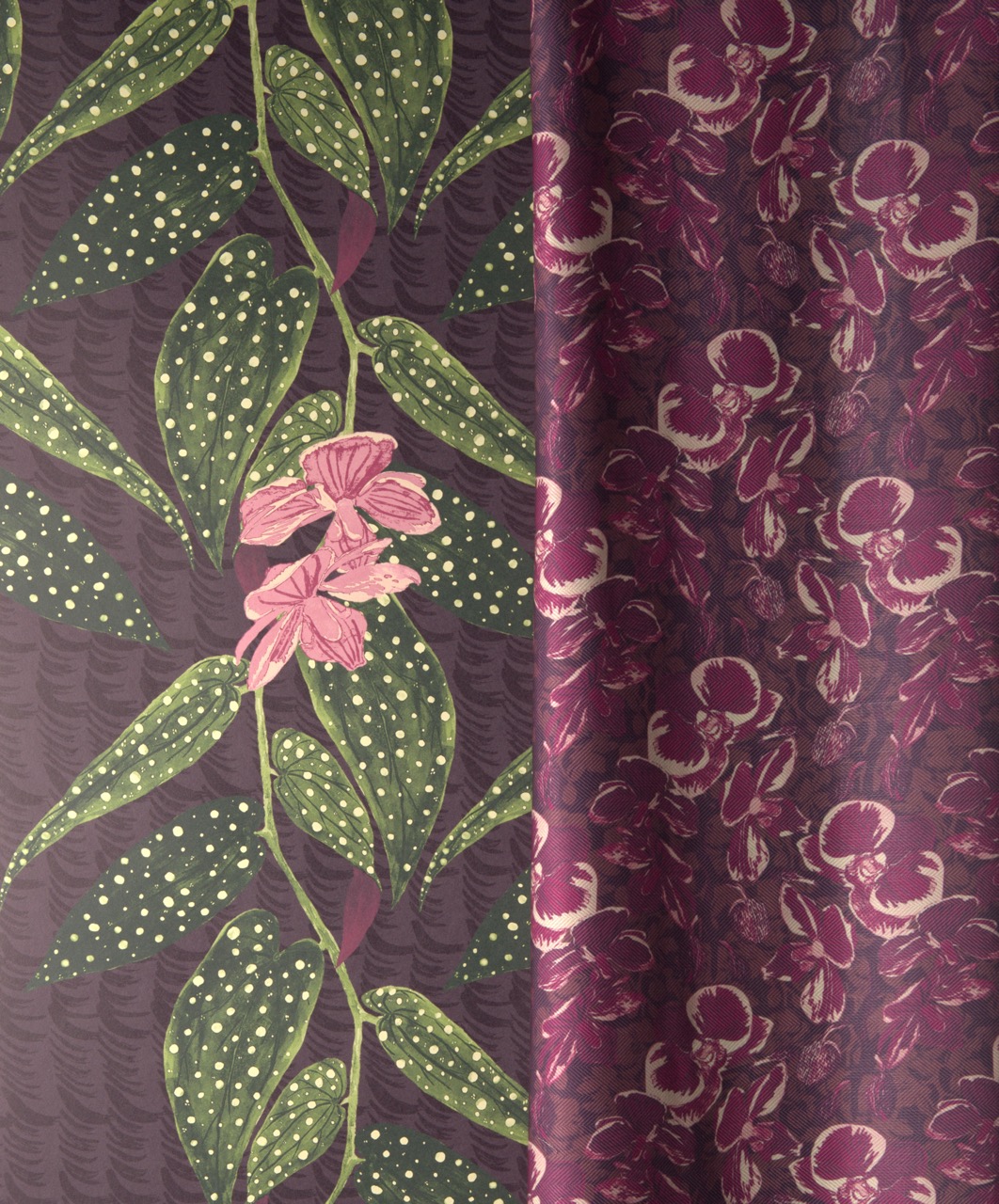 A close-up view of two contrasting fabric patterns. The left features dark green leaves and pink flowers against a patterned background, while the right displays a rich purple fabric with abstract floral designs in lighter shades.