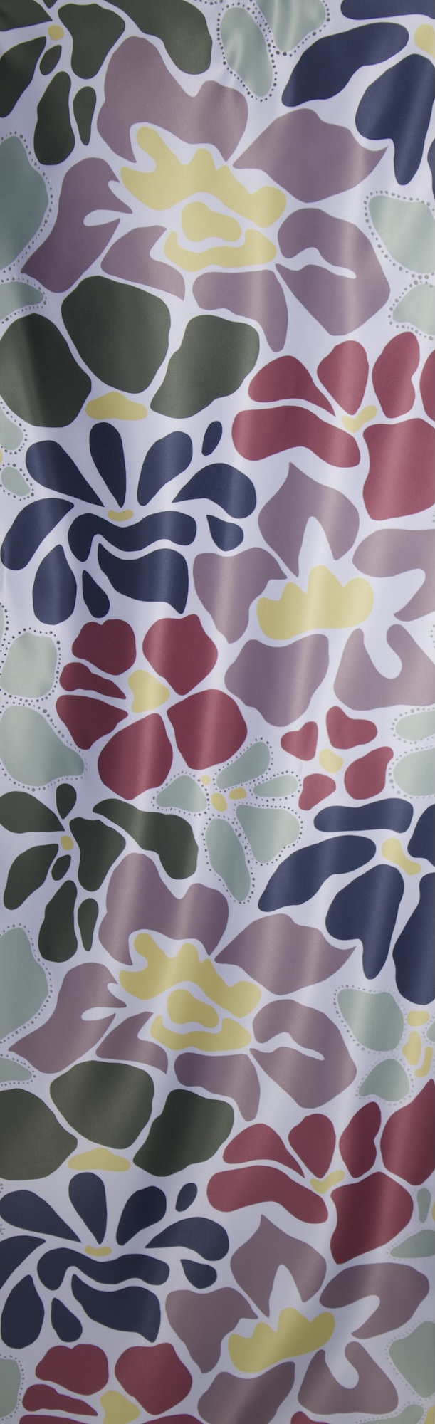 A vertical pattern featuring large, abstract floral shapes in various colours, including red, yellow, purple, and green, against a light background. The design has smooth curves and overlapping elements, creating a vibrant and dynamic look.