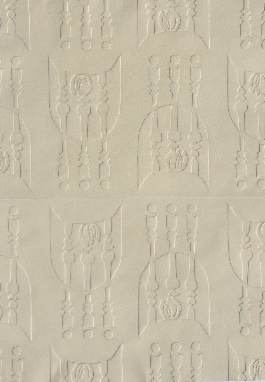 A textured wallpaper featuring a repeating pattern of embossed designs, including vertical lines and floral elements, on a light beige background.