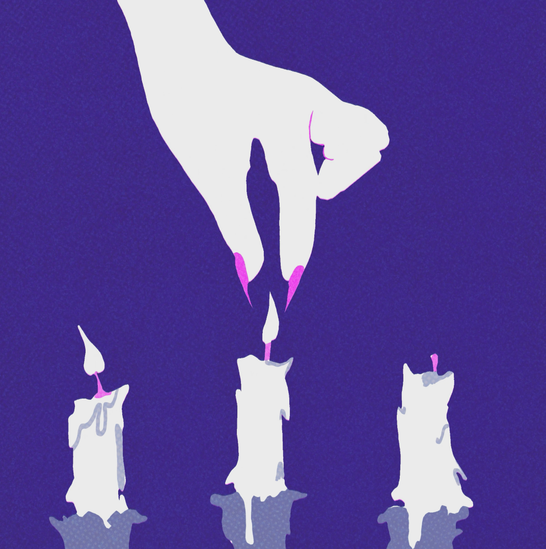 White hand with pink fingernails lighting middle candle of three white candles with purple flames against purple background.