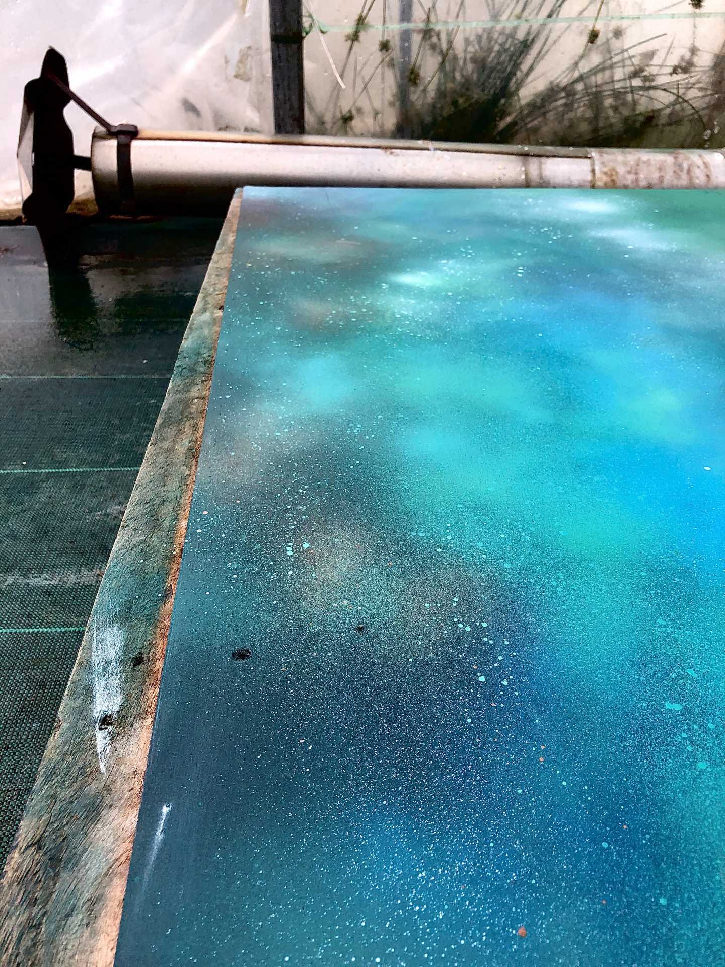 Woman stood by water