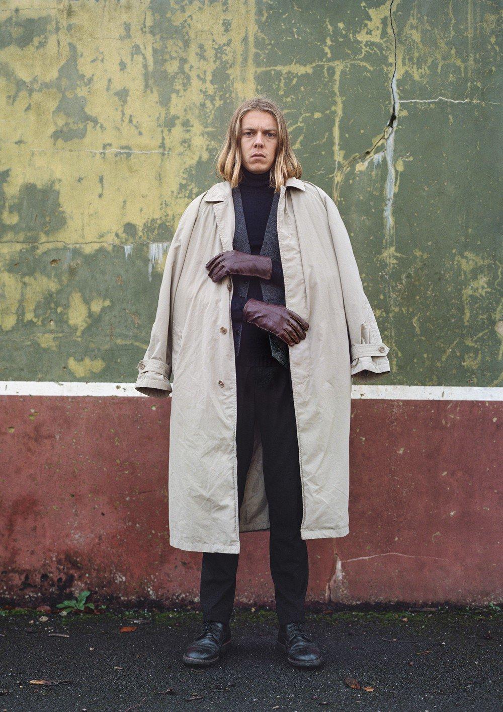 Man in front of a wall