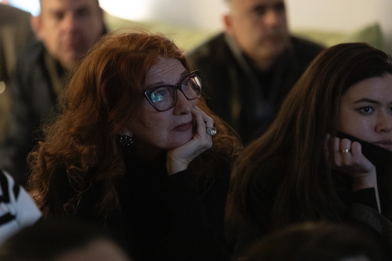 A woman watching the screenings at VVV Residency.