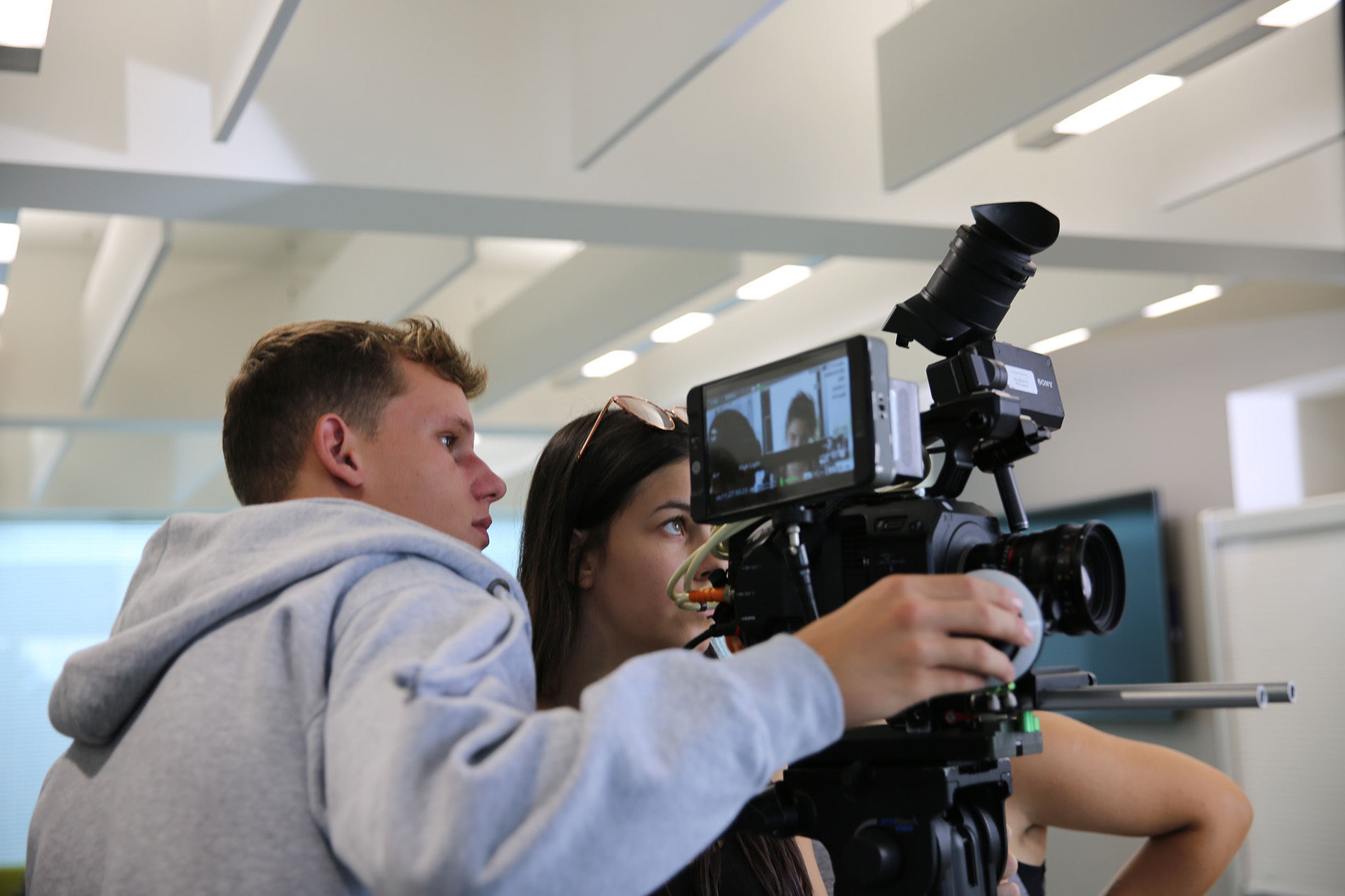 Students operating camera