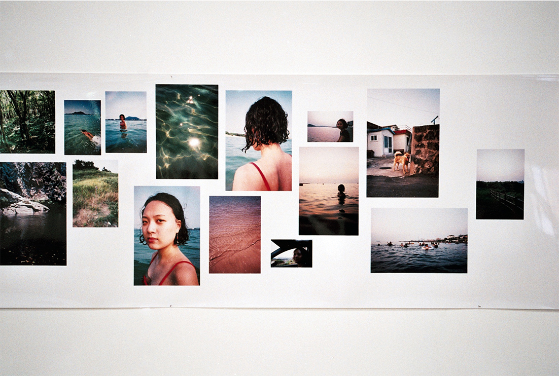 Exhibition of photographs of people swimming in the sea