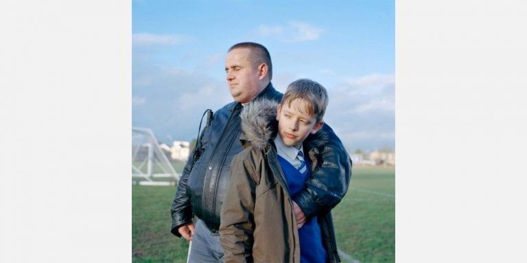 Dad and son on a playing field