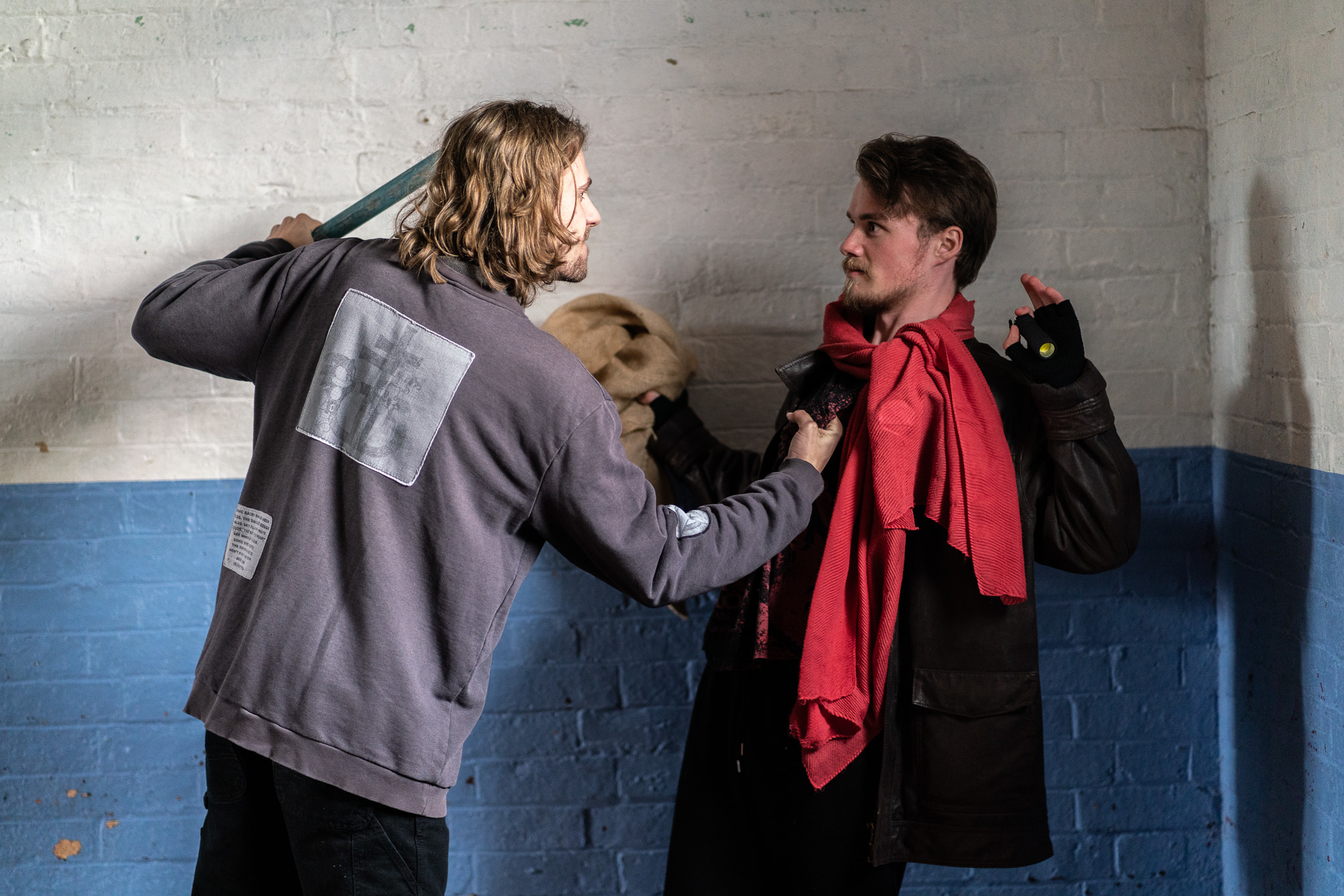 A fight breaks out between two characters in AUB Productions' Road