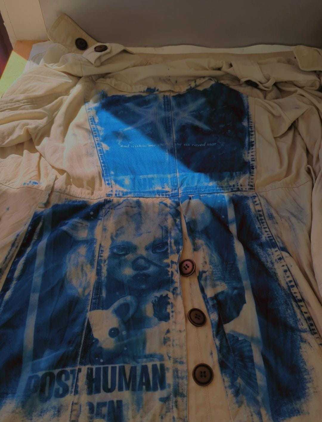 A garment with a cyanotype image printed onto it.