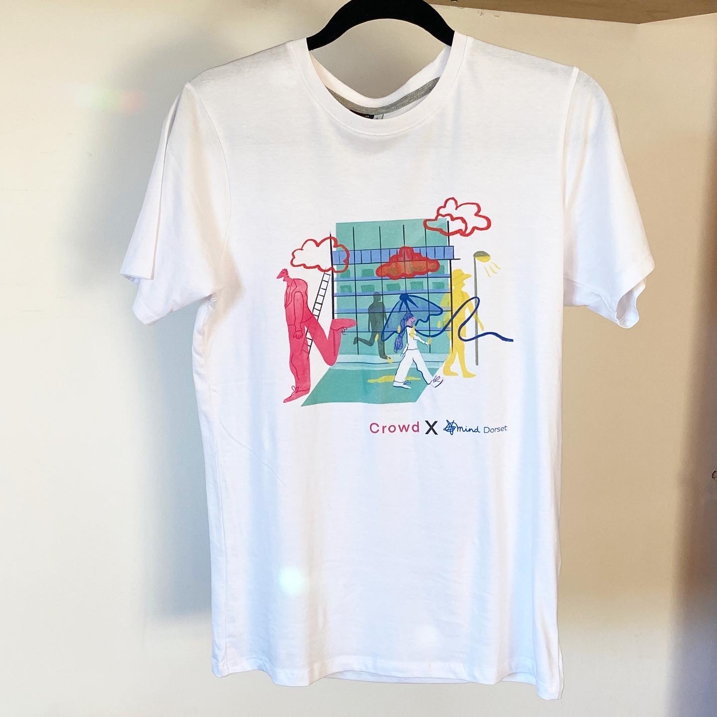A white t-shirt with an illustration by Sophie Hardyman.