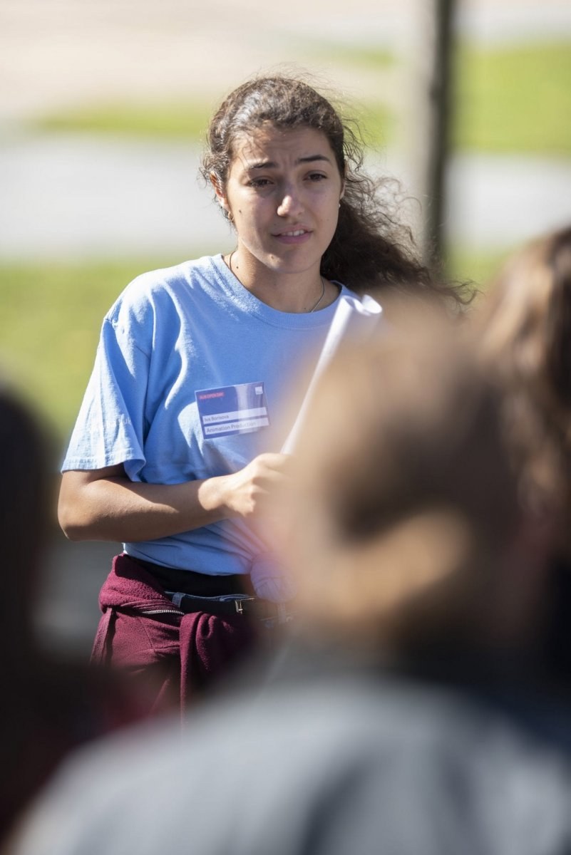 Student ambassador holding a document in their hands.