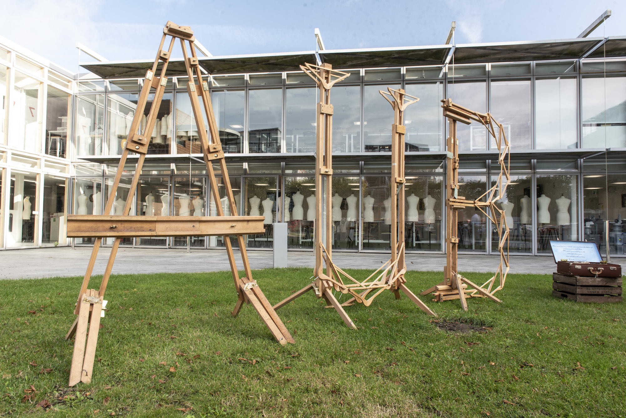 The letters "AUB" made out of artists' easels, constructed in the courtyard outside the West Building on AUB Campus.