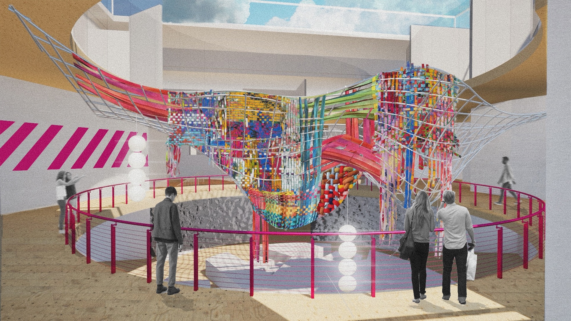 Indoor play area with colourful climbing structure featuring red, yellow, blue, and green elements surrounded by pink safety barriers.